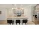 Modern kitchen with granite island and stainless steel appliances at 204 Villoresi Blvd, Nokomis, FL 34275