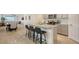 Modern kitchen with an island and stainless steel appliances at 204 Villoresi Blvd, Nokomis, FL 34275