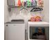 Convenient laundry room with washer, dryer, and shelving at 204 Villoresi Blvd, Nokomis, FL 34275