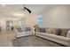 Open living area with light flooring and couches at 204 Villoresi Blvd, Nokomis, FL 34275