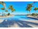 Expansive resort-style pool with palm trees at 204 Villoresi Blvd, Nokomis, FL 34275