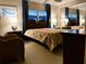 Bedroom with a queen-size bed and mirrored closet at 2107 Palma Sola Blvd # 27, Bradenton, FL 34209