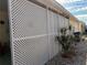 Covered patio with white latticework and landscaping at 2107 Palma Sola Blvd # 27, Bradenton, FL 34209