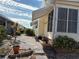 Landscaped side yard with rock pathway and plants at 2107 Palma Sola Blvd # 27, Bradenton, FL 34209
