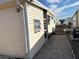 Side view of the yellow single-wide mobile home at 2107 Palma Sola Blvd # 27, Bradenton, FL 34209