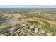 Aerial view of a house and surrounding golf course at 2305 Little Country Rd, Parrish, FL 34219