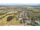 Aerial view of a house and surrounding golf course at 2305 Little Country Rd, Parrish, FL 34219