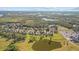 Aerial view of a house and surrounding golf course at 2305 Little Country Rd, Parrish, FL 34219