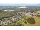 Aerial view of a house and surrounding golf course at 2305 Little Country Rd, Parrish, FL 34219