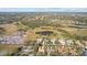 Aerial view of a house and surrounding golf course at 2305 Little Country Rd, Parrish, FL 34219