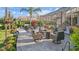 Spacious backyard patio with fire pit and seating area, perfect for outdoor entertaining at 2305 Little Country Rd, Parrish, FL 34219