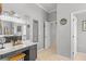 Vanity area in a well-lit bathroom with a large mirror at 2305 Little Country Rd, Parrish, FL 34219