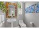 Elegant powder room with ornate mirror and modern fixtures at 2305 Little Country Rd, Parrish, FL 34219