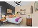 Bright bedroom with eclectic decor, featuring a comfortable bed and stylish accents at 2305 Little Country Rd, Parrish, FL 34219