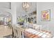 Sunlit dining room offering an open concept to the living room at 2305 Little Country Rd, Parrish, FL 34219