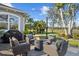 Outdoor fire pit surrounded by comfortable seating on a spacious patio at 2305 Little Country Rd, Parrish, FL 34219