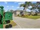 House exterior view with a large green lawn and driveway at 2305 Little Country Rd, Parrish, FL 34219