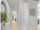 Bright hallway with neutral walls and decorative wall art at 2305 Little Country Rd, Parrish, FL 34219