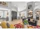 Bright living room with high ceilings, stylish furniture, and access to backyard at 2305 Little Country Rd, Parrish, FL 34219