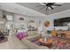 Open living room showcasing sectional sofa and views into the kitchen at 2305 Little Country Rd, Parrish, FL 34219