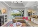 Relaxing living room boasts a sectional sofa and access to the pool at 2305 Little Country Rd, Parrish, FL 34219