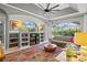 Spacious living room with built-in shelving and pool view at 2305 Little Country Rd, Parrish, FL 34219