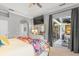 Main bedroom with private access to a relaxing patio at 2305 Little Country Rd, Parrish, FL 34219