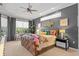 Bright main bedroom features a large bed and stylish decor at 2305 Little Country Rd, Parrish, FL 34219