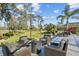 Outdoor patio area with fire pit and comfortable seating at 2305 Little Country Rd, Parrish, FL 34219