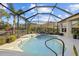 Relaxing freeform pool with spa and screened enclosure at 2305 Little Country Rd, Parrish, FL 34219