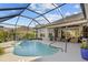 Inviting freeform pool with spa and screened enclosure at 2305 Little Country Rd, Parrish, FL 34219