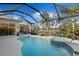 Stunning pool area with spa, screened enclosure, and golf course view at 2305 Little Country Rd, Parrish, FL 34219