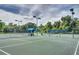 Tennis courts with a covered seating area at 2305 Little Country Rd, Parrish, FL 34219