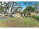 Cute yellow house with a one car garage and well-manicured lawn at 253 Southampton Dr # 298, Venice, FL 34293