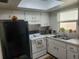 Galley kitchen with black appliances and ample counter space at 2905 51St W Ave, Bradenton, FL 34205