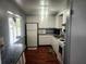 Simple kitchen with white cabinets and appliances at 2905 51St W Ave, Bradenton, FL 34205