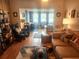Bright living room with water view, comfy seating, and hardwood floors at 2905 51St W Ave, Bradenton, FL 34205
