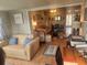 Living room with open floor plan, neutral decor, and access to patio at 2905 51St W Ave, Bradenton, FL 34205