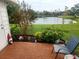 Relaxing patio with pond view, brick pavers, and lush landscaping at 2905 51St W Ave, Bradenton, FL 34205