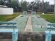 Shuffleboard court with benches and green surface at 2905 51St W Ave, Bradenton, FL 34205