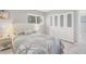 Bedroom with a queen-size bed, built-in closet, and window at 3500 Beneva Rd # 303, Sarasota, FL 34232