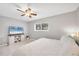 Bedroom with a queen-size bed, TV, and ceiling fan at 3500 Beneva Rd # 303, Sarasota, FL 34232