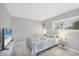 Bedroom with a queen bed, TV, and side table at 3500 Beneva Rd # 303, Sarasota, FL 34232