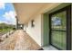 Exterior view of building showcasing entrance and landscaping at 3500 Beneva Rd # 303, Sarasota, FL 34232