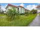 Building exterior with palm trees and walkway at 3500 Beneva Rd # 303, Sarasota, FL 34232