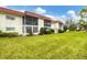 View of building exterior and surrounding landscape at 3500 Beneva Rd # 303, Sarasota, FL 34232