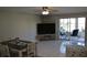 Bright living room with dining area and patio access at 3500 Beneva Rd # 303, Sarasota, FL 34232