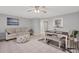 Living room features a sofa, ottoman, and adjacent dining area at 3500 Beneva Rd # 303, Sarasota, FL 34232