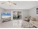 Living room with tiled floors, patio access, and comfy seating at 3500 Beneva Rd # 303, Sarasota, FL 34232