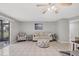 Living room with sofa, chair, and access to patio at 3500 Beneva Rd # 303, Sarasota, FL 34232